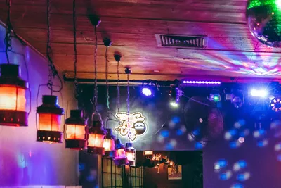 Lanterns, a disco ball and coloured DJ lights over the Asian Beer Cafe dance floor