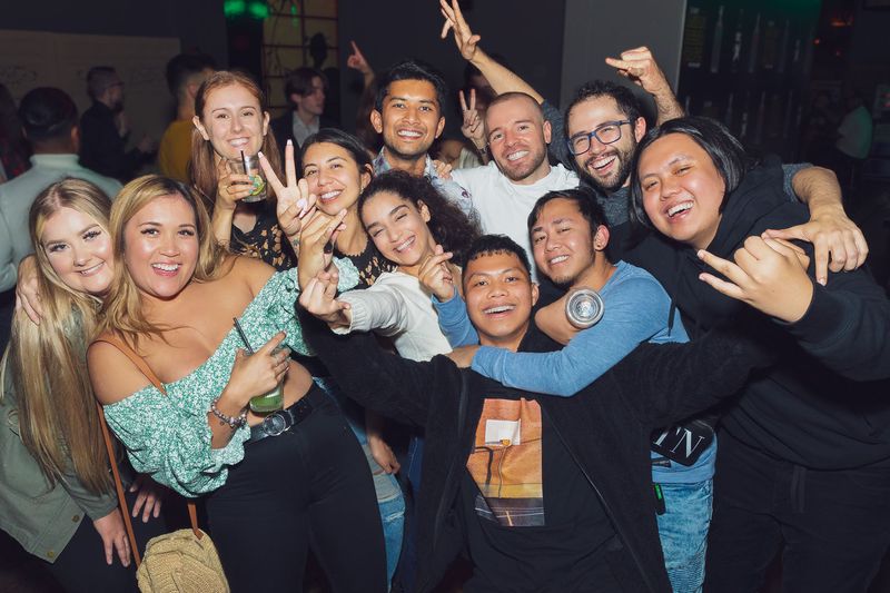 A group of friends celebrating a night out at Asian Beer Cafe