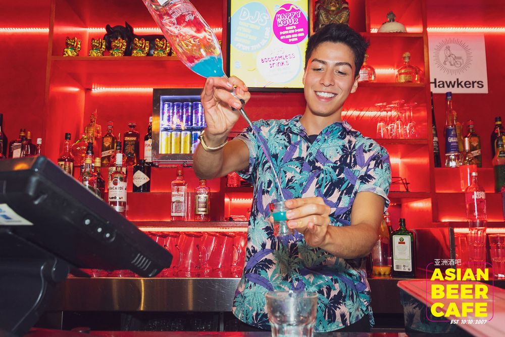 A bartender making a cocktail